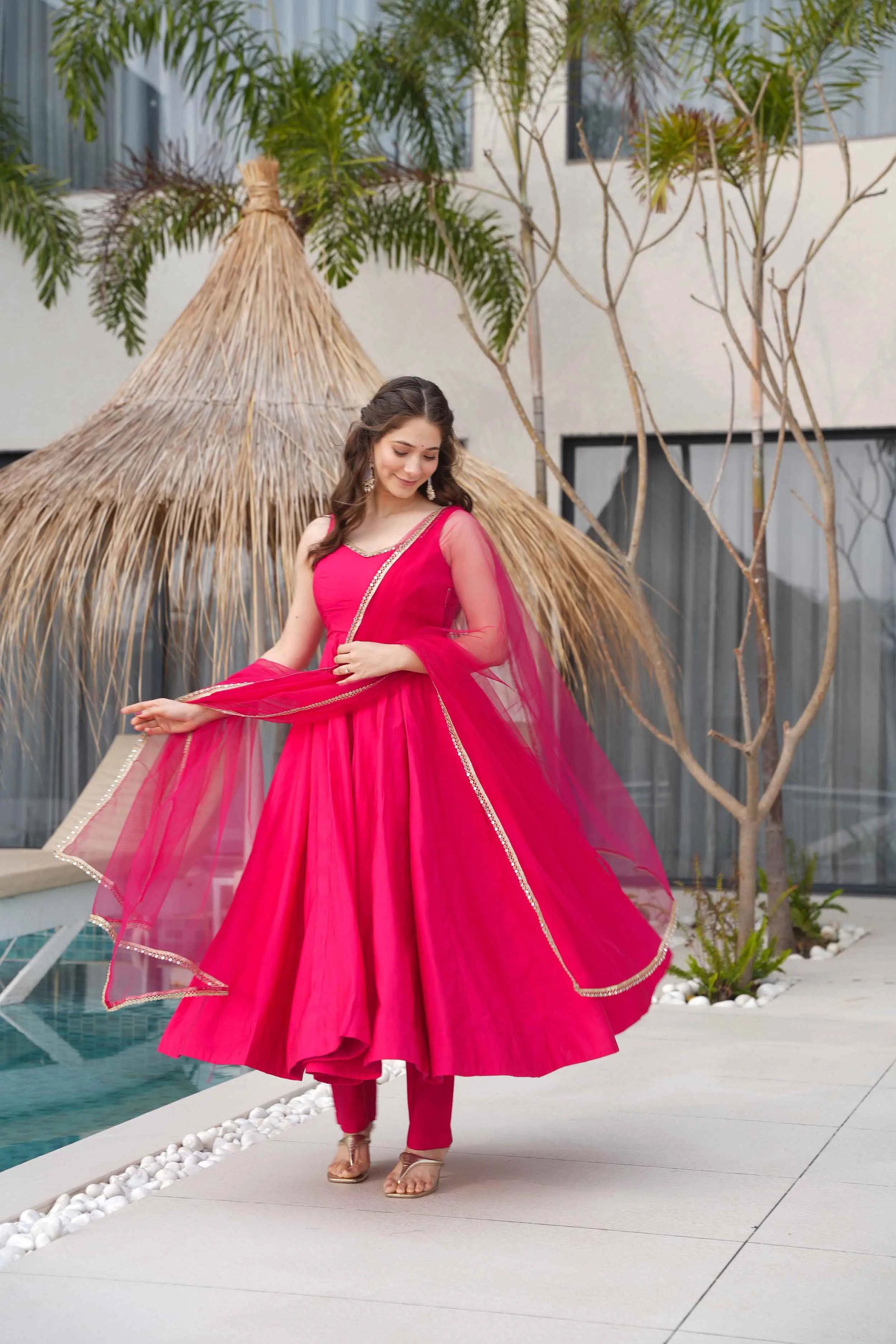 Rani Pink Roman Silk Plain Gown With Mirror Work And Net Dupatta - qivii