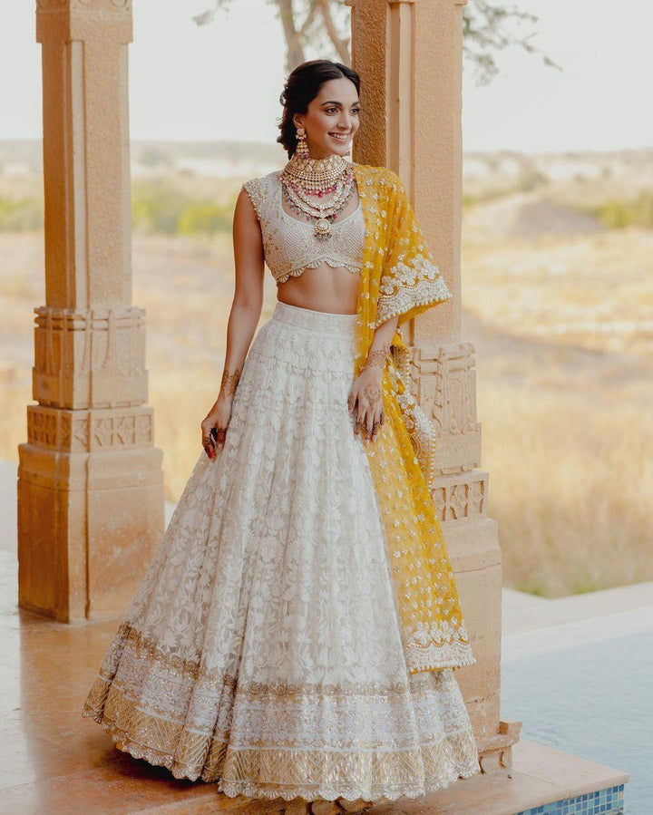 Beautifully handcrafted white designer lehenga choli with heavy embroidery