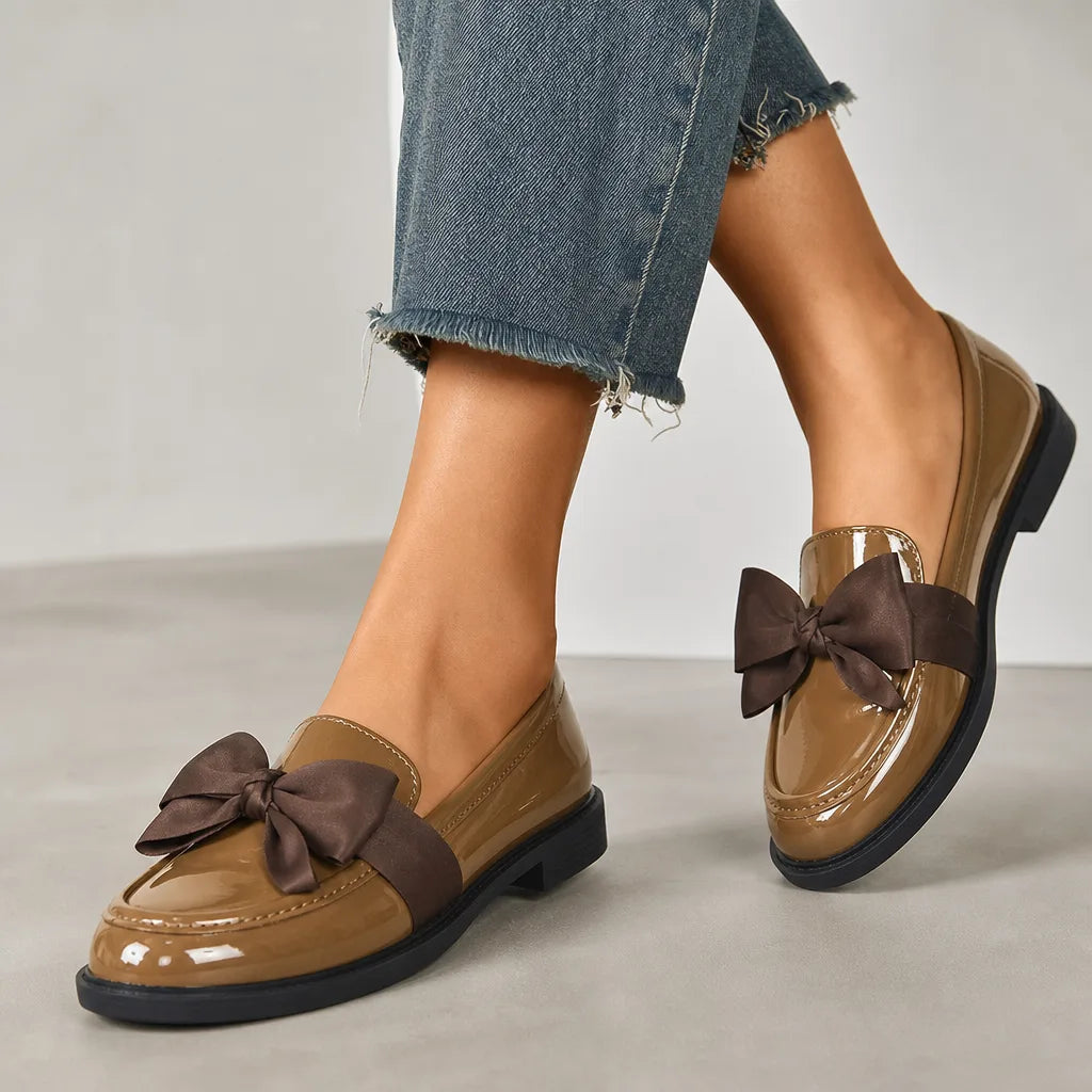 Beige women's bow loafers by Hudson Ridge, part of the Lawrence collection, featuring stylish and comfortable women's footwear.