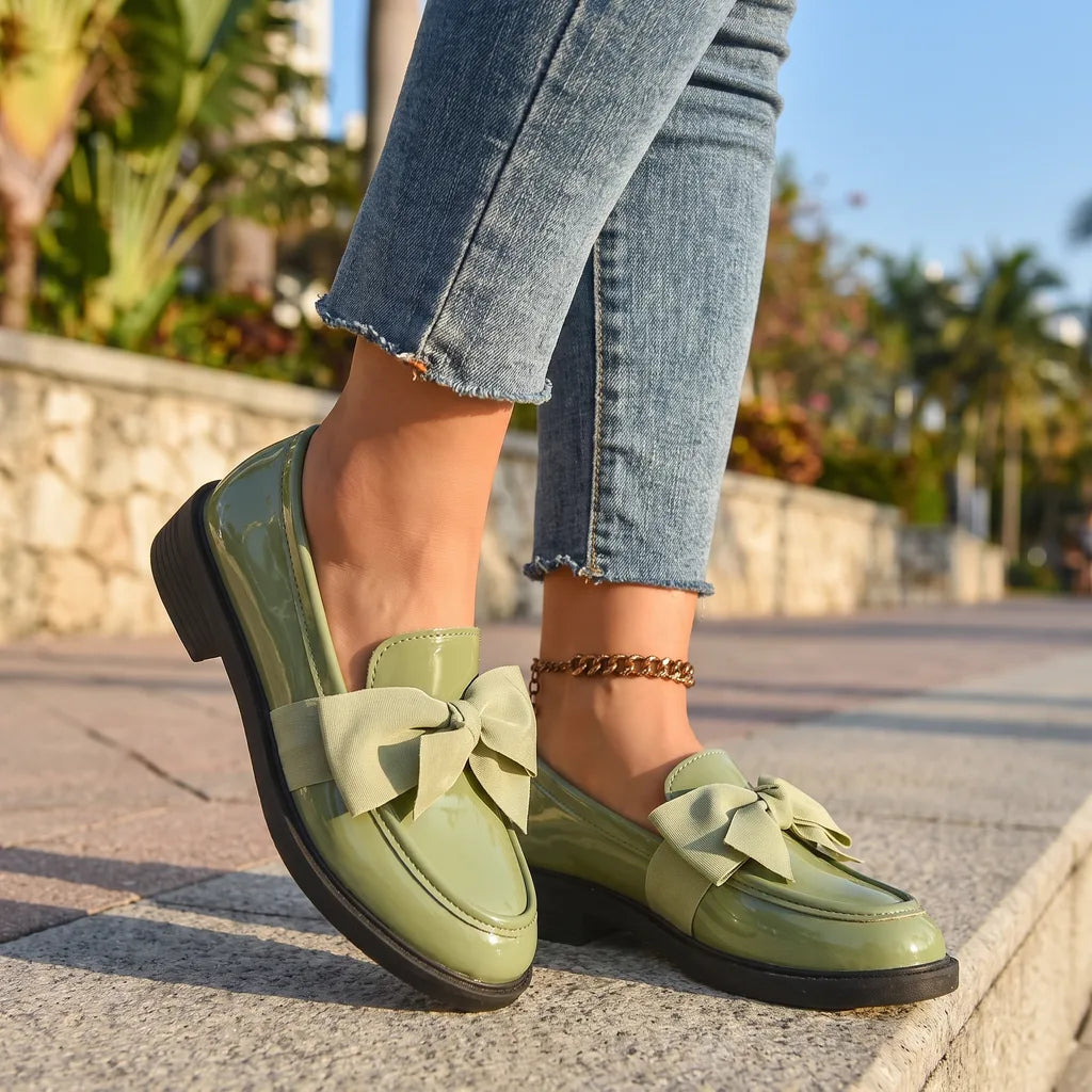 Green women's bow loafers by Hudson Ridge, part of the Lawrence collection, featuring classic slip-on style and comfortable footwear.