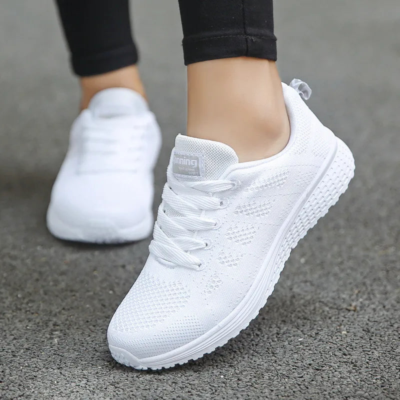 White women's orthopedic walking shoes by Qivii, style Mabry, from Hudson Ridge, designed for comfort and support during walks.