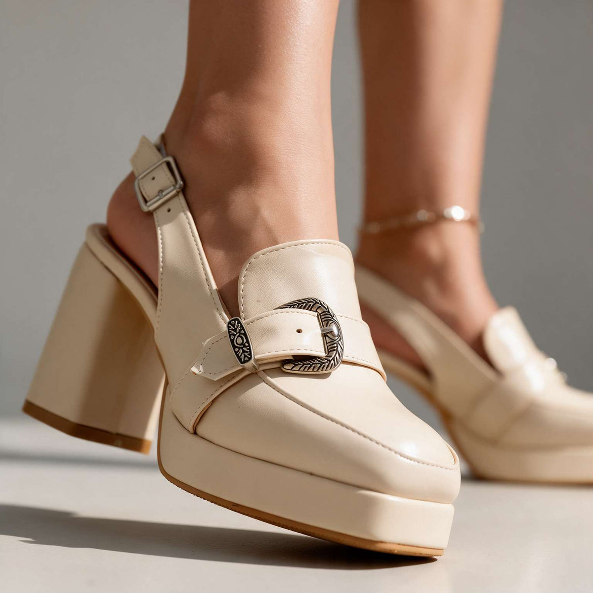 Close-up of Sienna women's slingback sandal heels by Hudson Ridge, showing elegant design and tan leather straps.