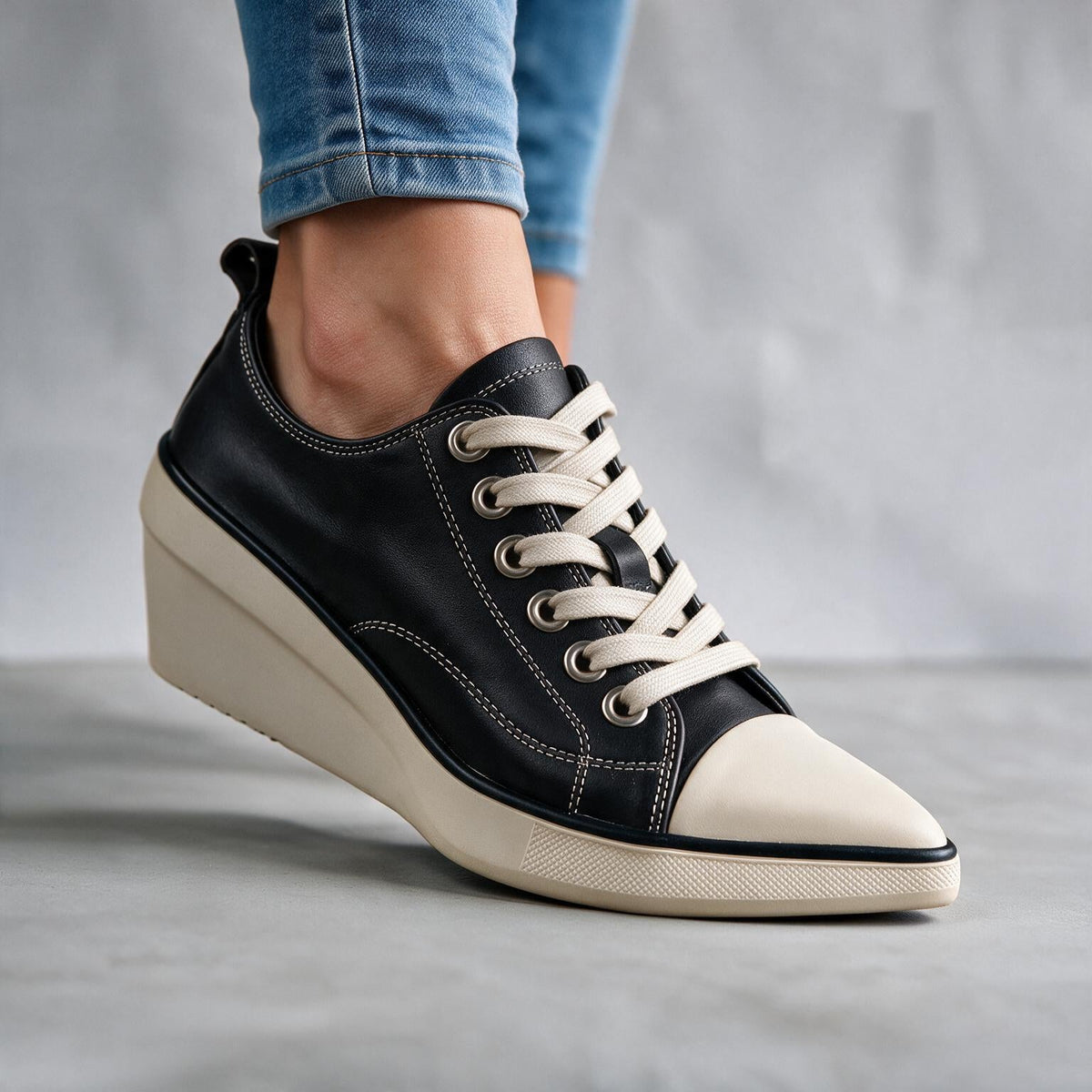 Skyla Wedge Sneakers by Qivii in women's footwear, stylish sneakers with a wedge heel, shown in a sleek design and casual look.