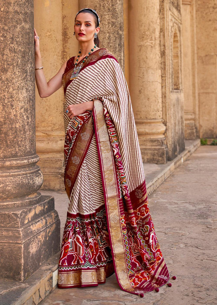 Mahogany Red Designer Patola Silk Saree with Zari Border & Stone work(Pre-Order) | Stitched Blouse - qivii