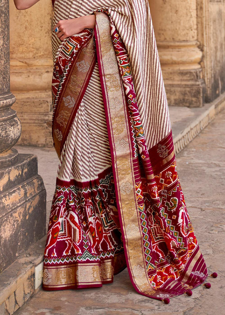 Mahogany Red Designer Patola Silk Saree with Zari Border & Stone work(Pre-Order) | Stitched Blouse - qivii