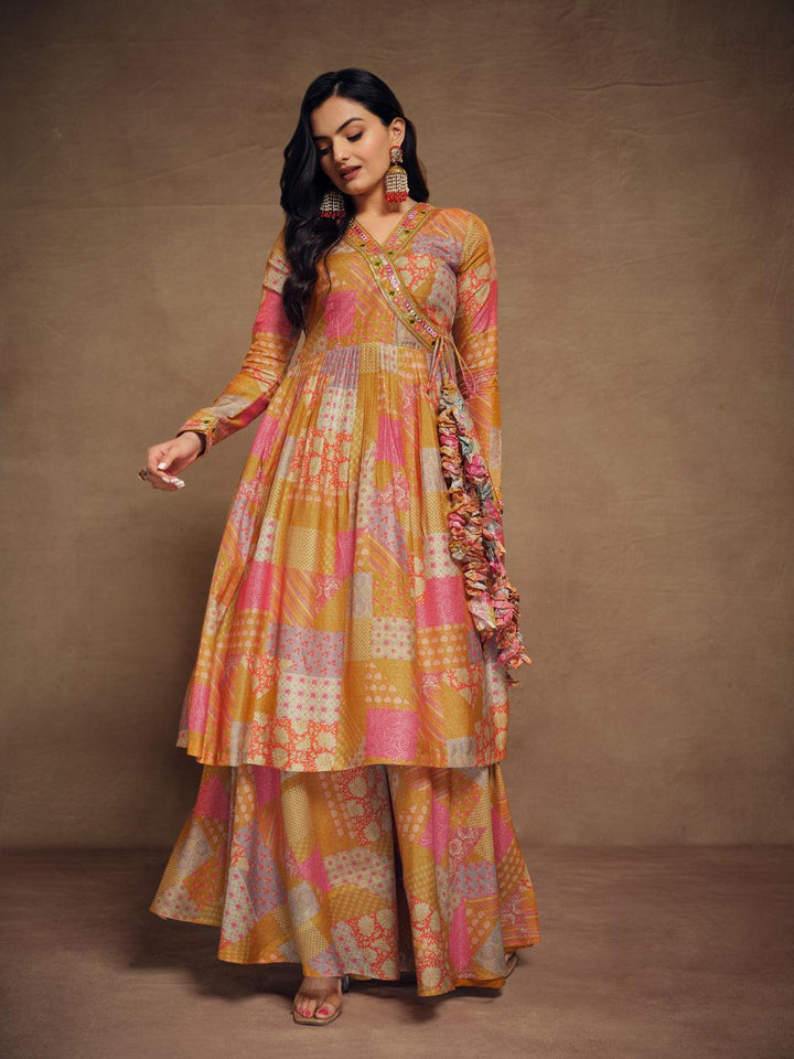 Mustard color muslin palazzo suit with intricate embroidery detail by Qivii