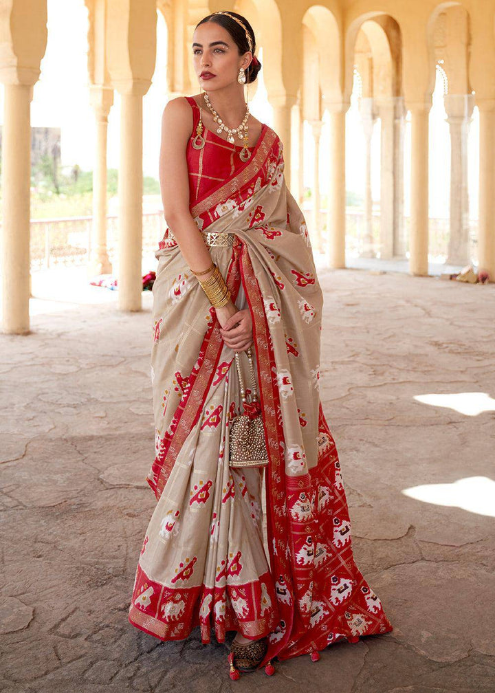 Oat Brown Printed Patola Silk Saree with Zari Border & Tassels on Pallu | Stitched Blouse - qivii