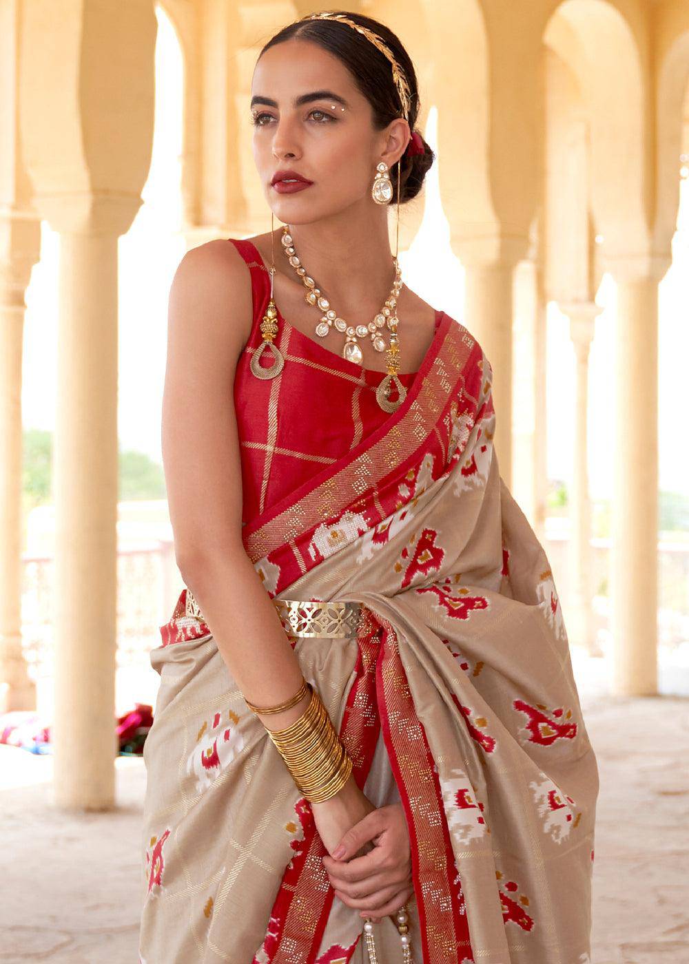 Oat Brown Printed Patola Silk Saree with Zari Border & Tassels on Pallu | Stitched Blouse - qivii