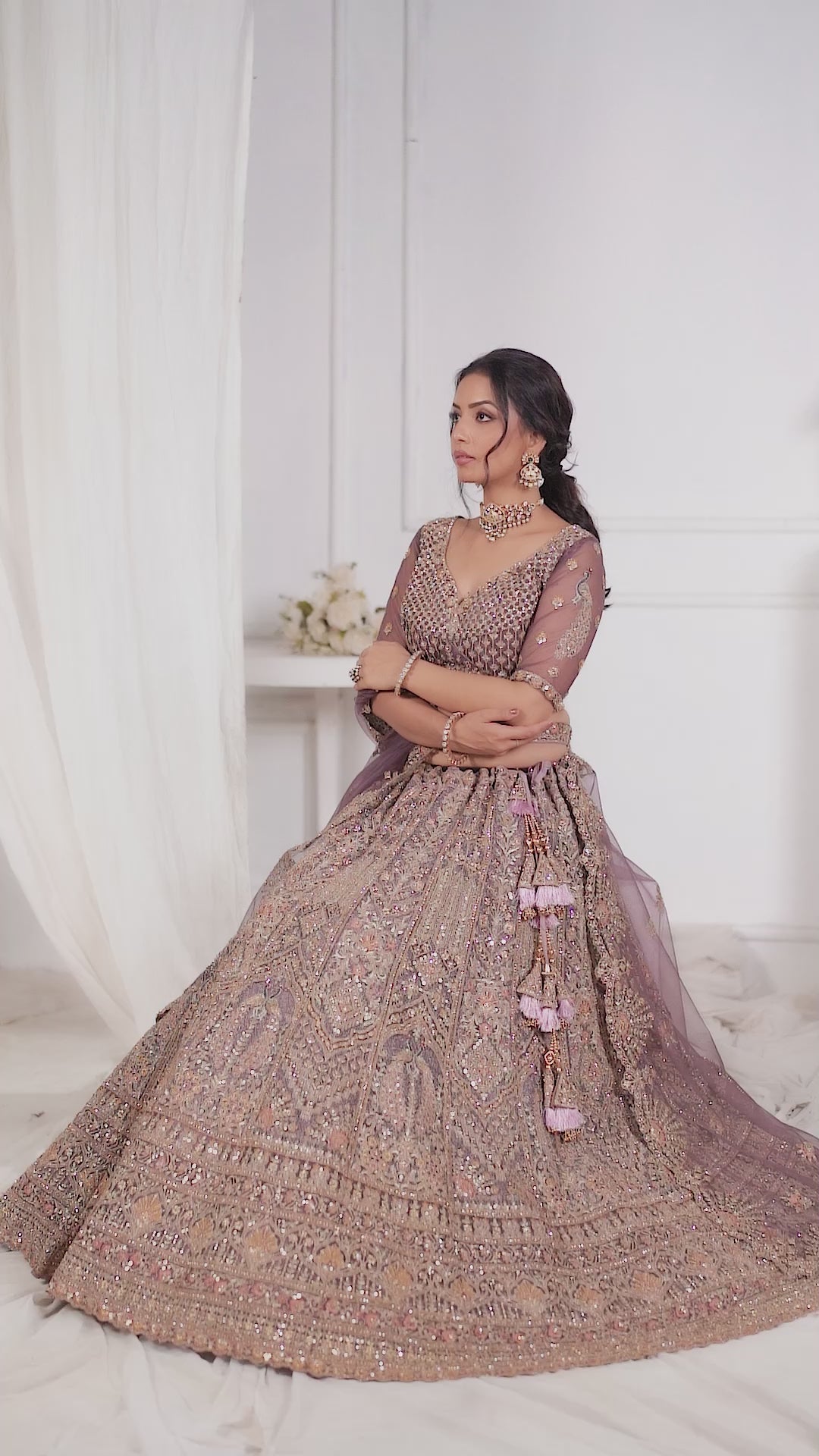 Royal Grandeur bridal  Purple Soft Net Lehenga with Paisley and Peacock Motifs & Heavy Embroidery