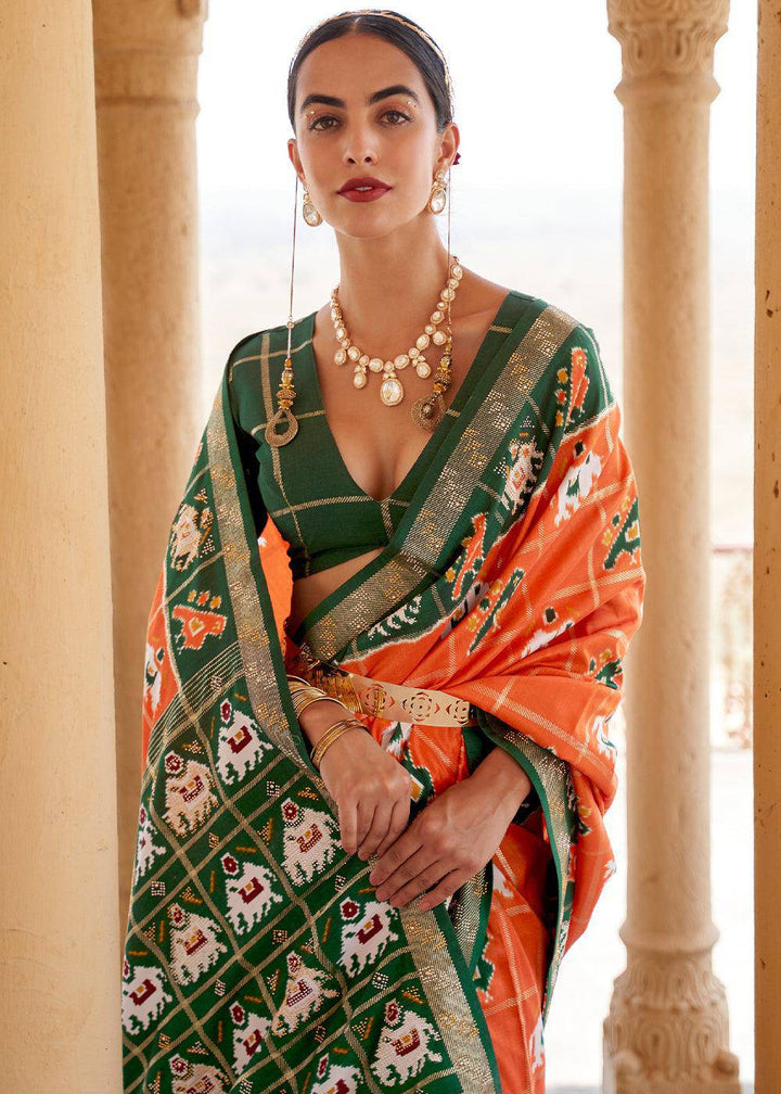 Pumpkin Orange Printed Patola Silk Saree with Zari Border & Tassels on Pallu | Stitched Blouse - qivii