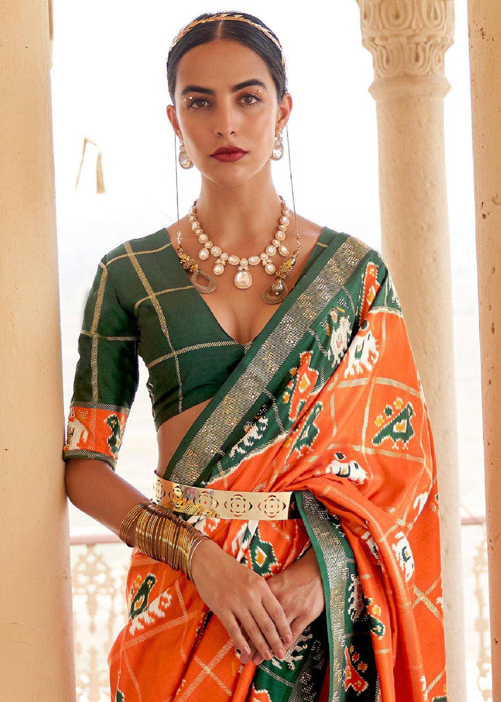 Pumpkin Orange Printed Patola Silk Saree with Zari Border & Tassels on Pallu | Stitched Blouse - qivii