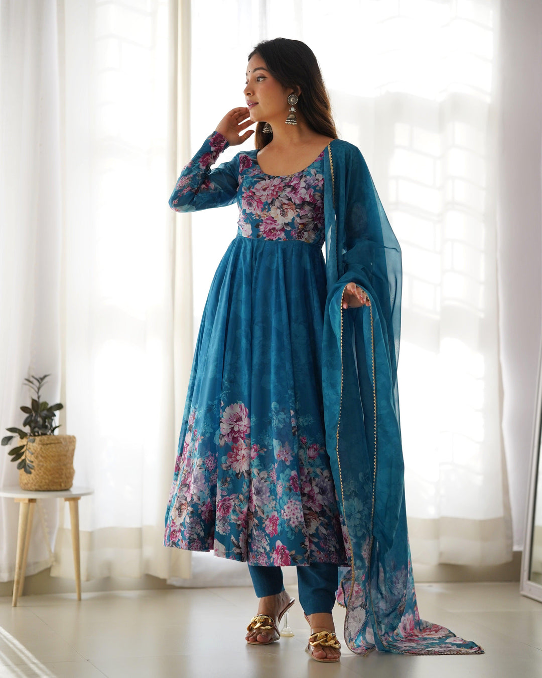 Elegant anarkali suit in Rama color with intricate print design