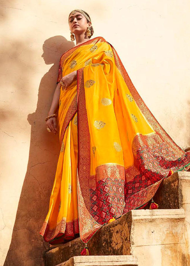 Saffron Yellow Woven Banarasi Patola Silk Saree with Embroidered Blouse | Stitched Blouse - qivii