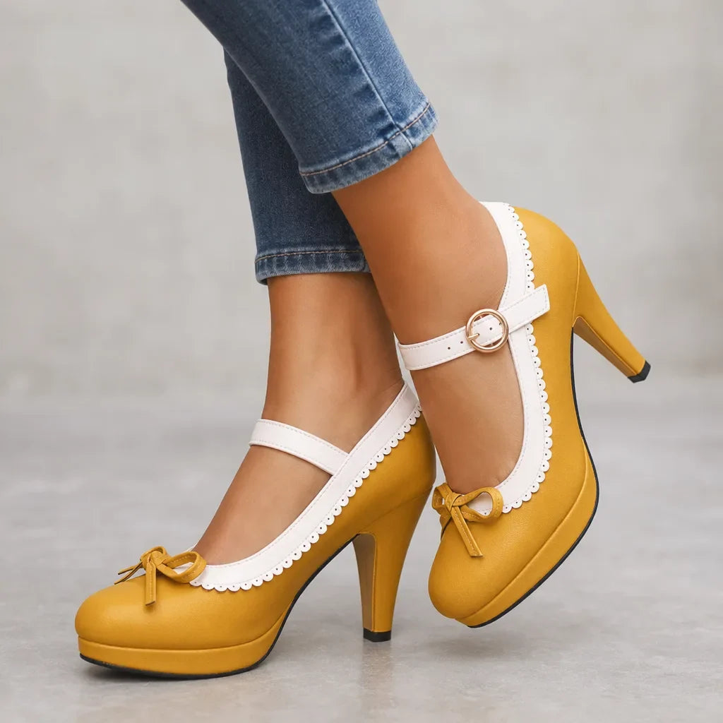 Yellow women's orthopedic Mary Jane heels with bow detail from Qivii's Seraphina collection by Hudson Ridge.