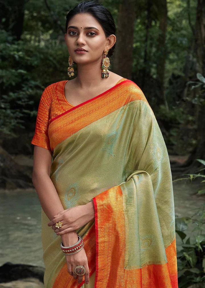 Tea Green Zari Woven Kanjivaram Silk Saree | Stitched Blouse - qivii