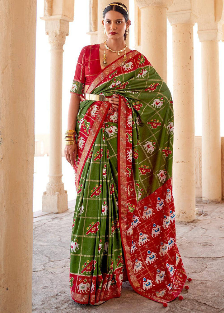 Verdun Green Printed Patola Silk Saree with Zari Border & Tassels on Pallu | Stitched Blouse - qivii