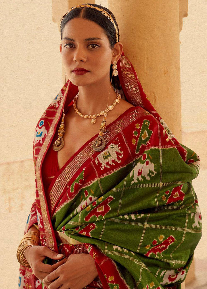 Verdun Green Printed Patola Silk Saree with Zari Border & Tassels on Pallu | Stitched Blouse - qivii