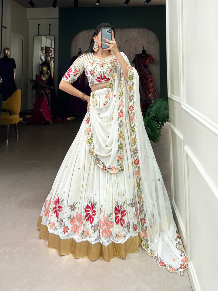 Beautiful white georgette lehenga with intricate sequins and thread embroidery work, featuring an embossed design lace for an elegant and stylish look