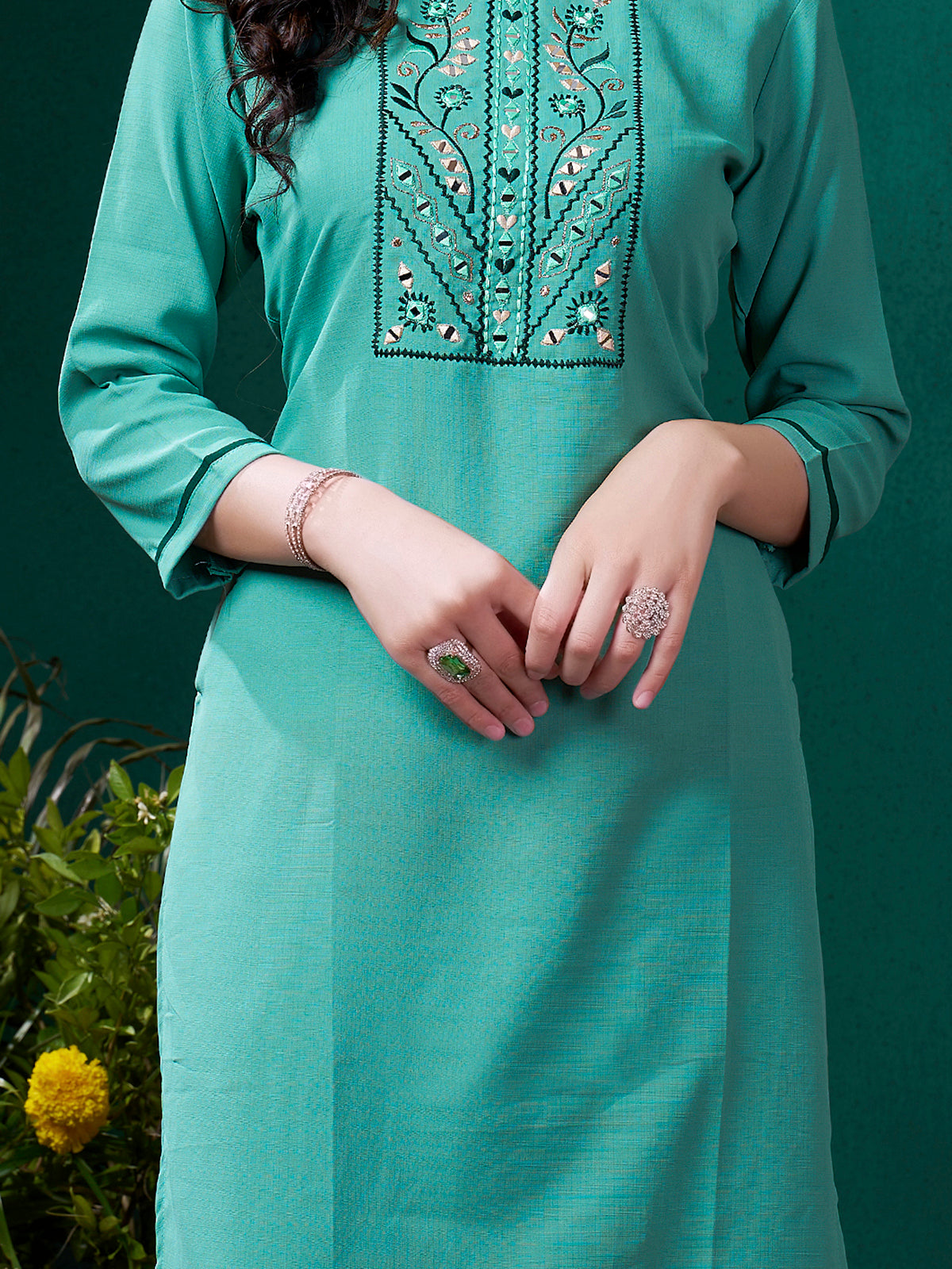 Classic white rayon pants paired with stunning sea green cotton suit