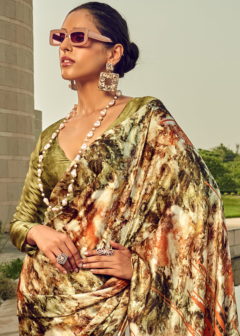  Beautiful Avocado Green Satin Silk Saree with Floral Motifs and Gold Accents